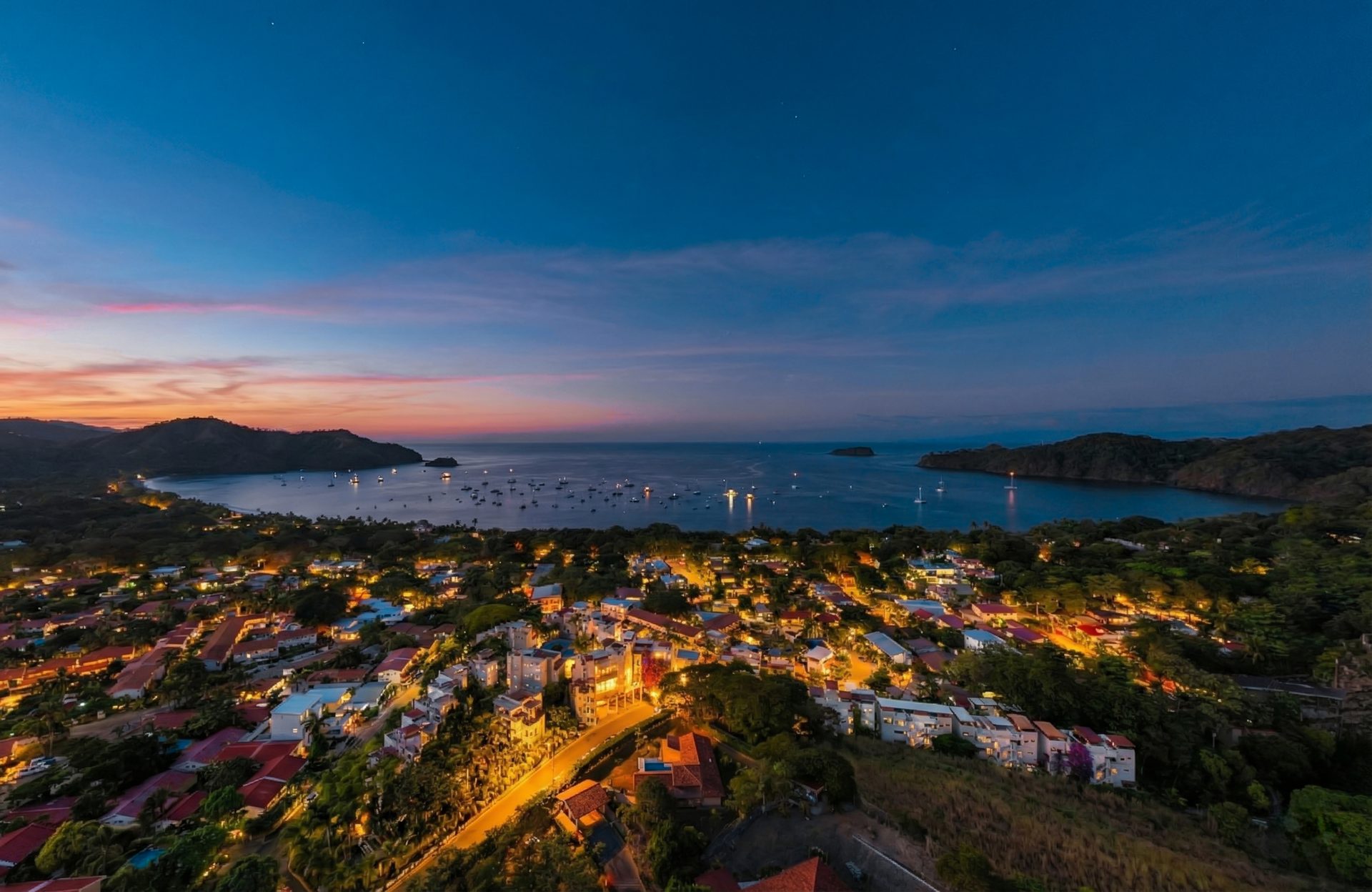 Downtown Playas del Coco at dusk, the town Marina Loft sits in