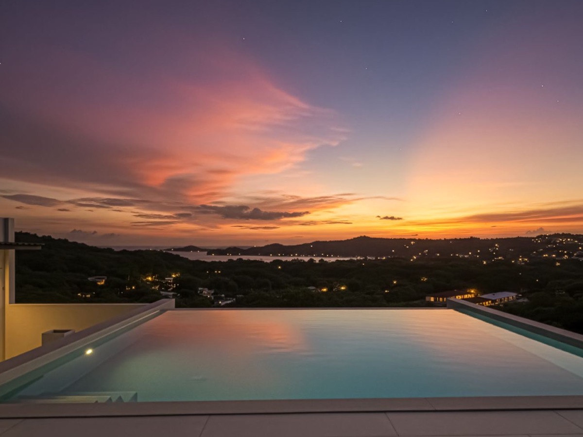 Rooftop pool at sunset over Playas del Coco