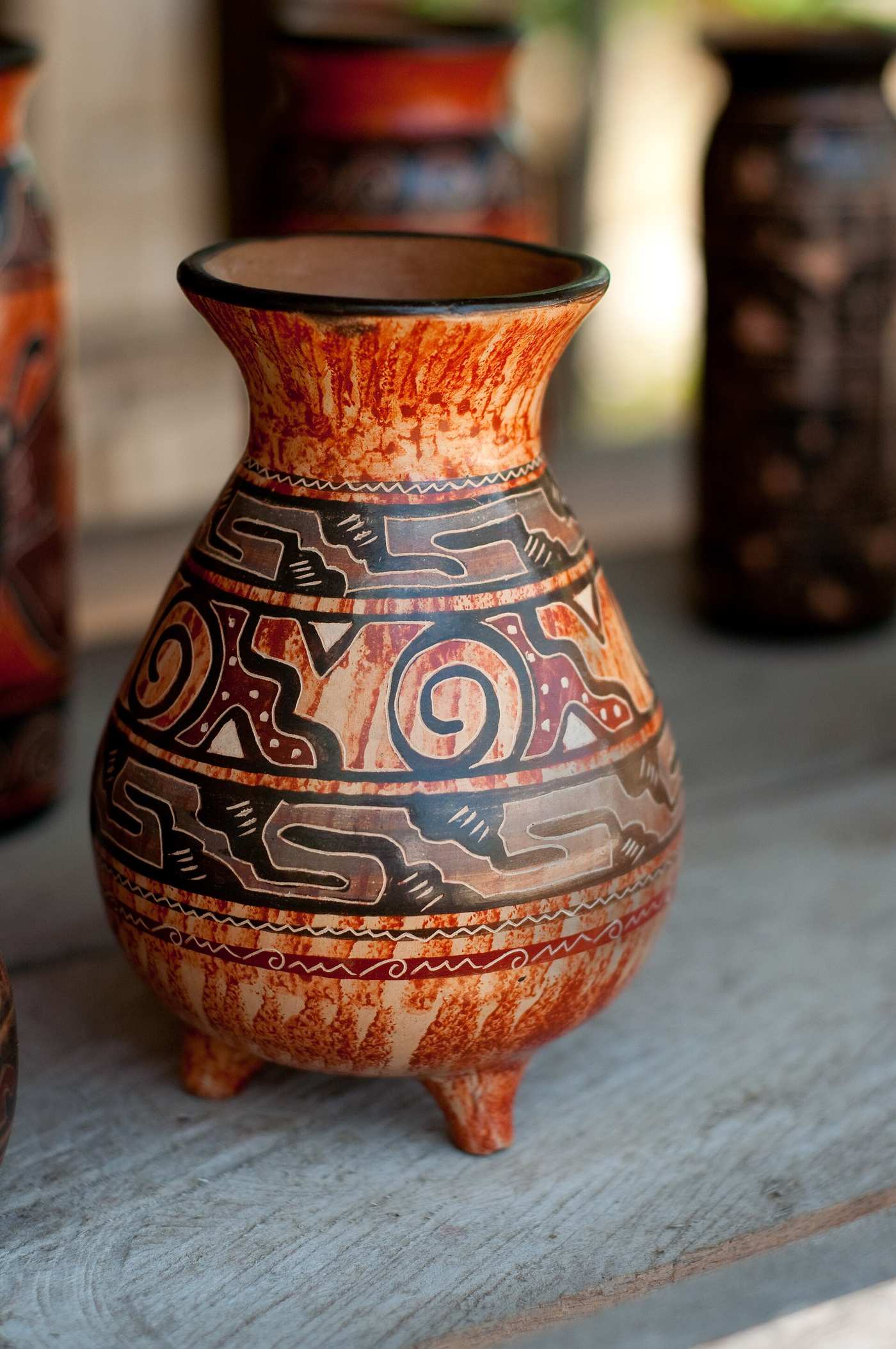 Handmade Chorotega pottery in reds and creams displayed in Guaitil, Guanacaste, Costa Rica