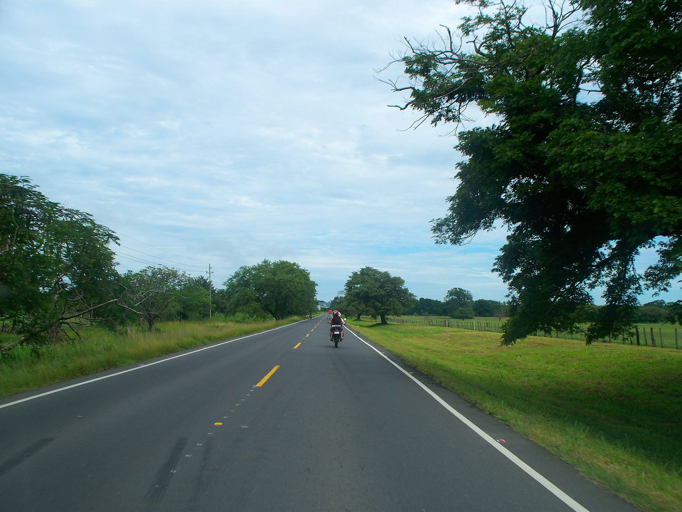 Pan-American Highway stretching through open Guanacaste countryside in northern Costa Rica