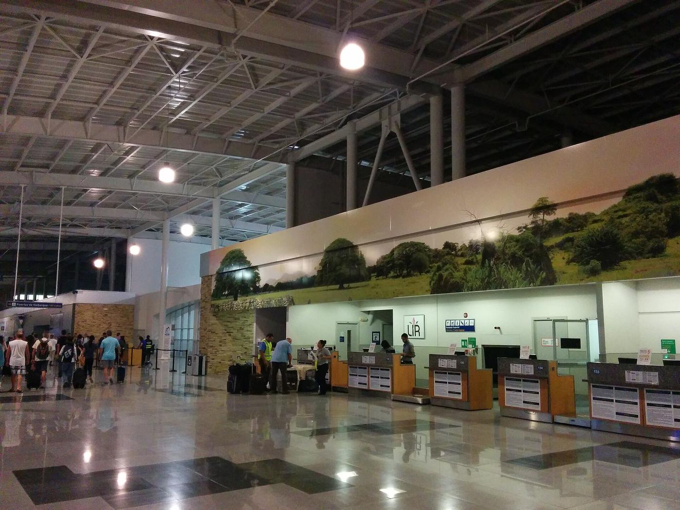 Check-in hall of Liberia airport's modern terminal, the gateway that reshaped Coco's main street