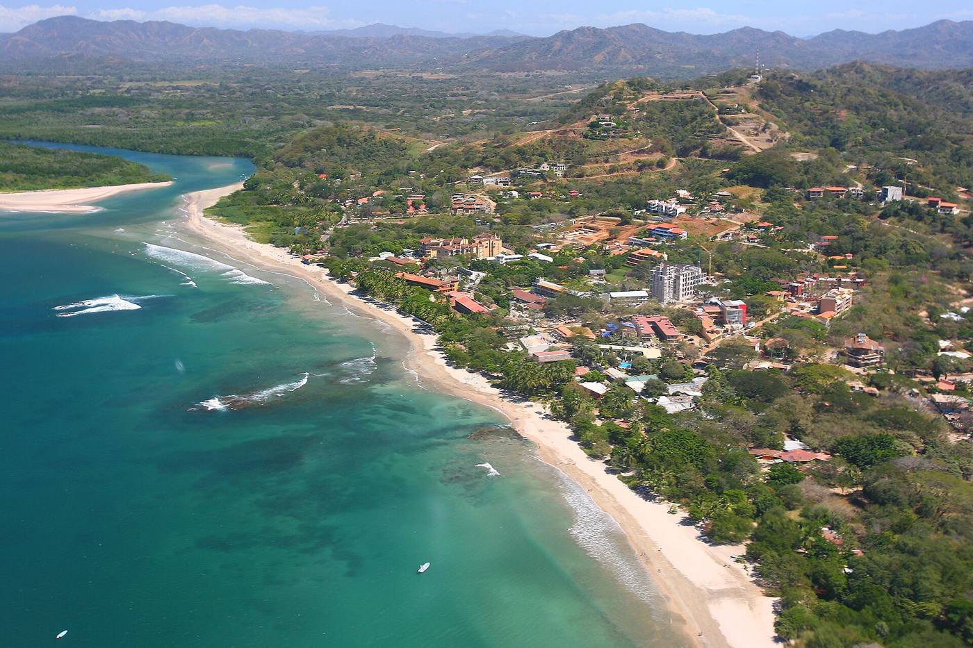 Aerial view of Tamarindo beachfront hotels and homes along Costa Rica's maritime zone