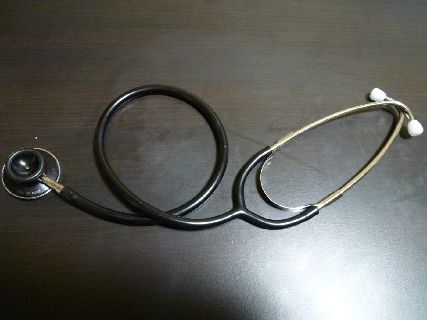 Doctor's stethoscope on a plain background, symbol of health coverage choices in Costa Rica