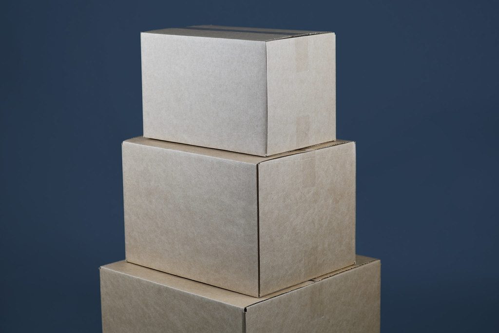 A stack of cardboard moving boxes packed for an international move