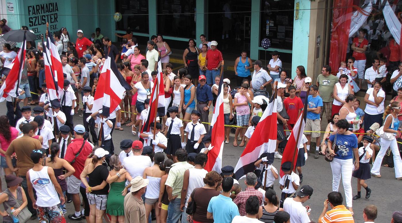 School marching band parades through the street on Independence Day in Costa Rica