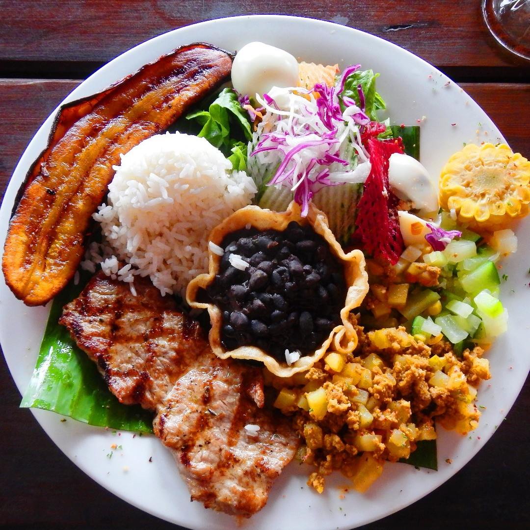 Casado plate with rice, beans, plantains and salad, the classic Costa Rican lunch