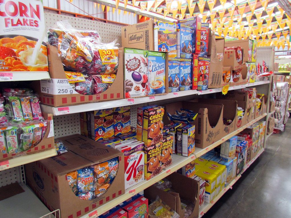 Grocery aisle with colones price tags inside a Pali supermarket in Costa Rica