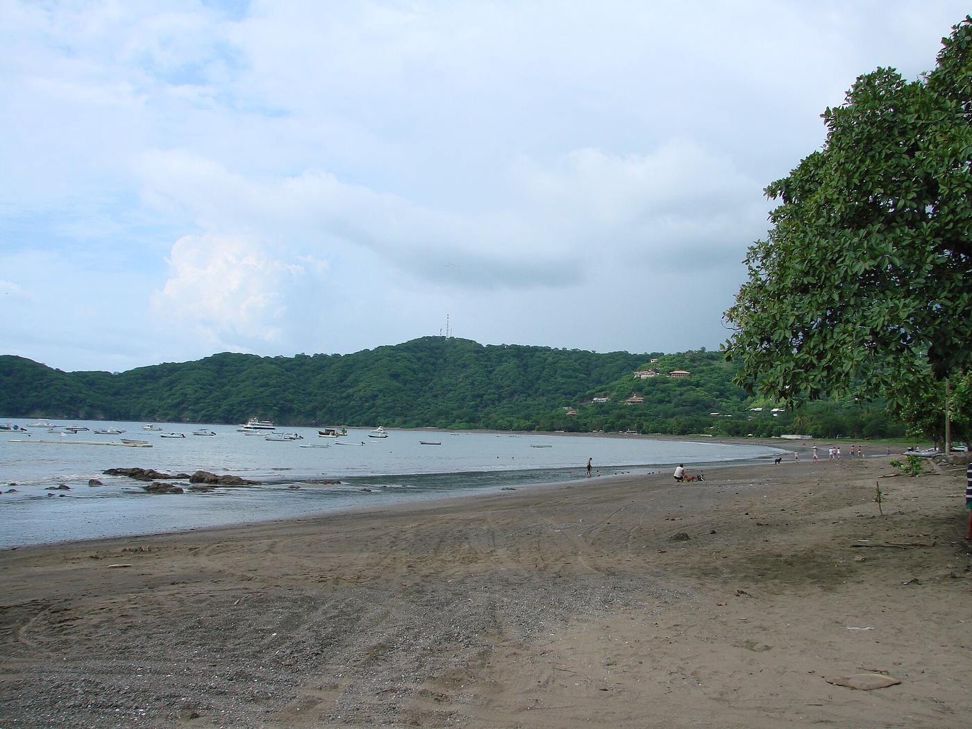 Small fishing boats anchored in the calm bay at Playas del Coco, Costa Rica