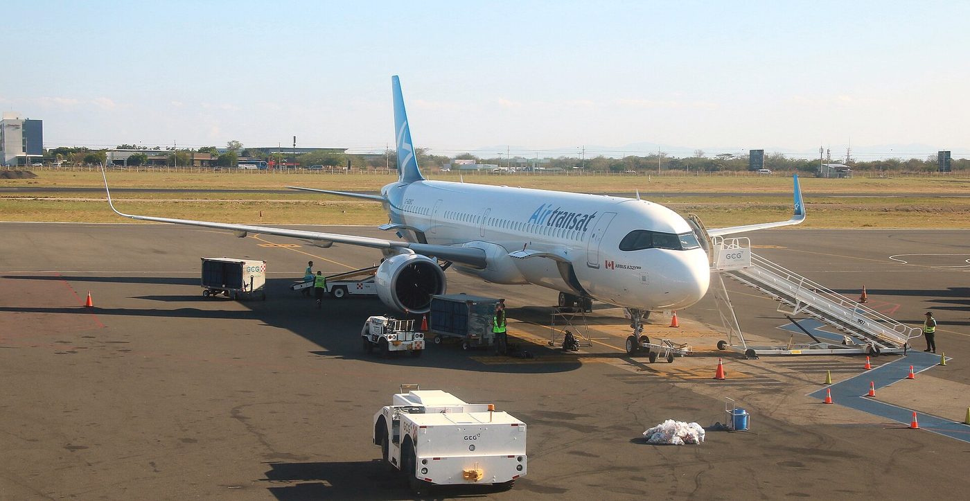 Air Transat jet unloading on the tarmac at Liberia airport in Guanacaste, Costa Rica