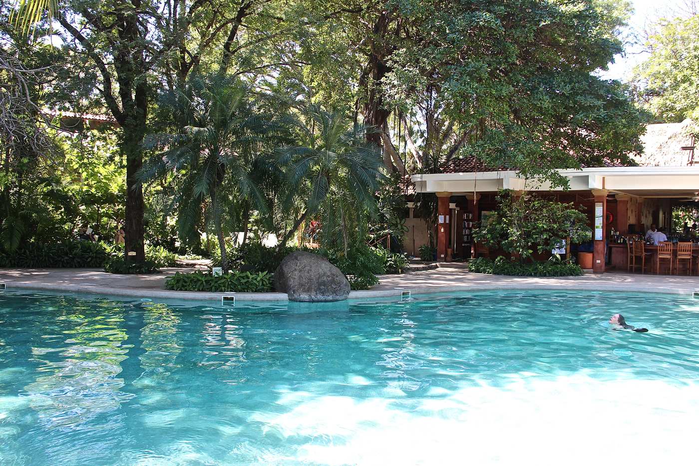 Turquoise pool and tropical garden at a vacation property in Tamarindo, Costa Rica